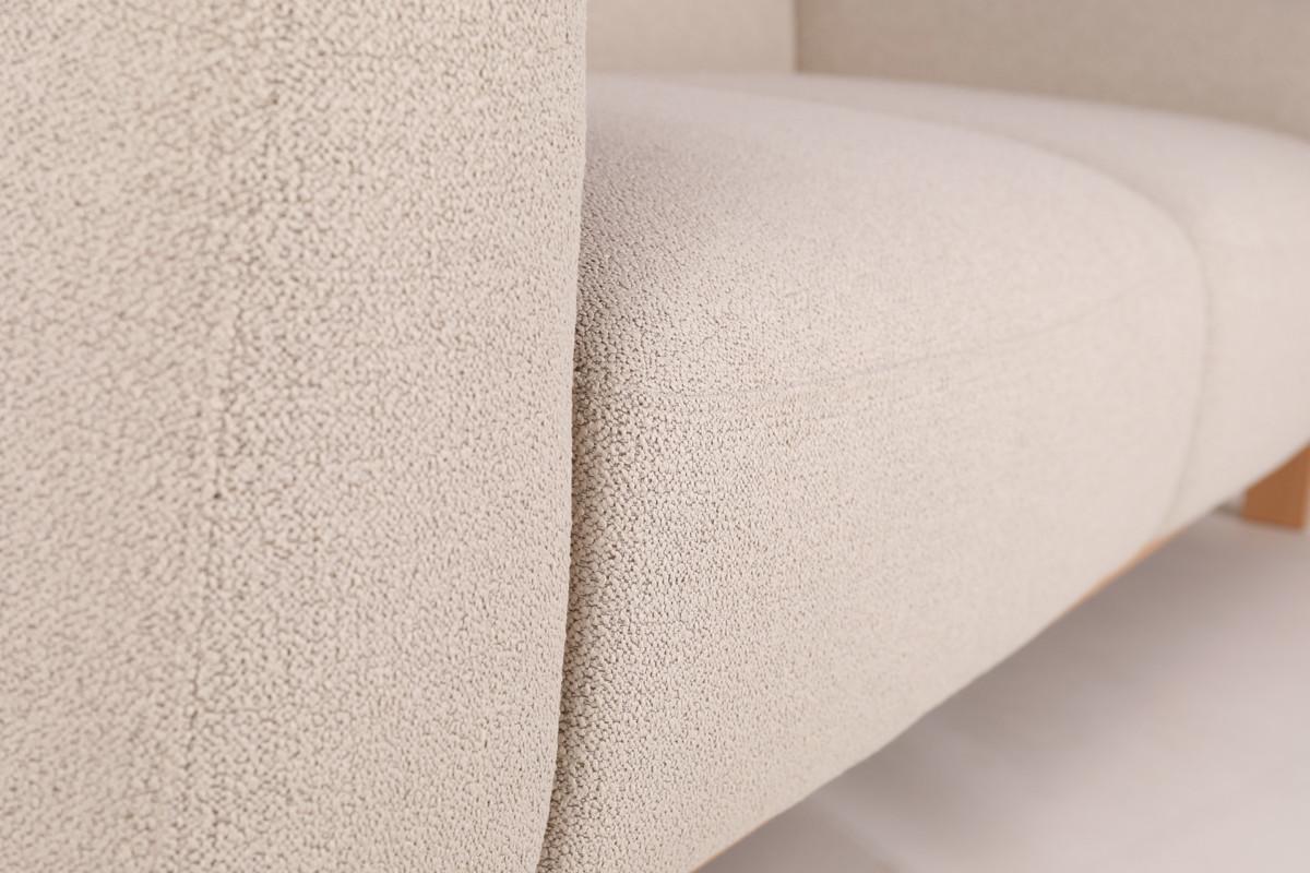 Casia-sohva on kiinteästi verhoiltu vaaleanbeigellä laadukkaalla Lauritzonin kankaalla