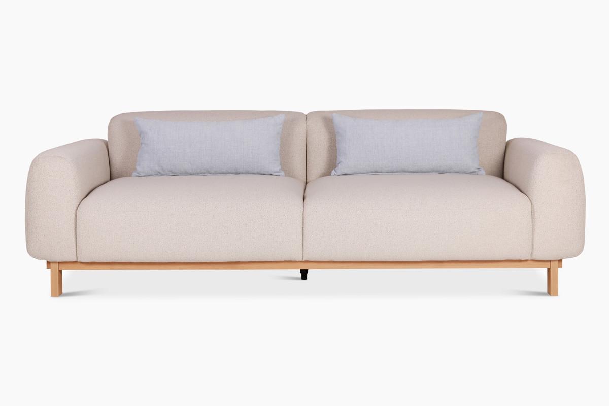 Casia-sohva on kiinteästi verhoiltu vaaleanbeigellä laadukkaalla Lauritzonin kankaalla