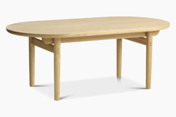 Inkoo-sohvapöydän pyöreästi muotoiltu pöydän kansi ja jalat korostavat sohvapöydän sulavalinjaisuutta.