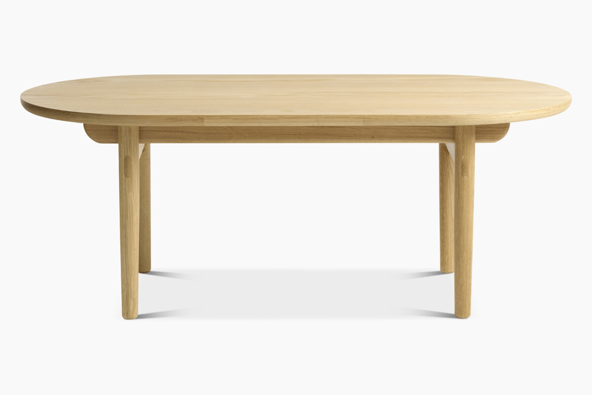 Inkoo-sohvapöydän pyöreästi muotoiltu pöydän kansi ja jalat korostavat sohvapöydän sulavalinjaisuutta.